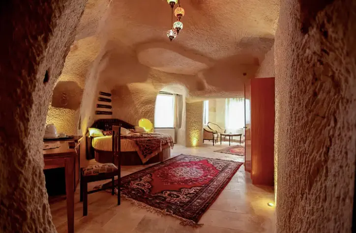 Historic luxury cave hotel suite carved into ancient volcanic tuff in Cappadocia - Authentic boutique estate verification