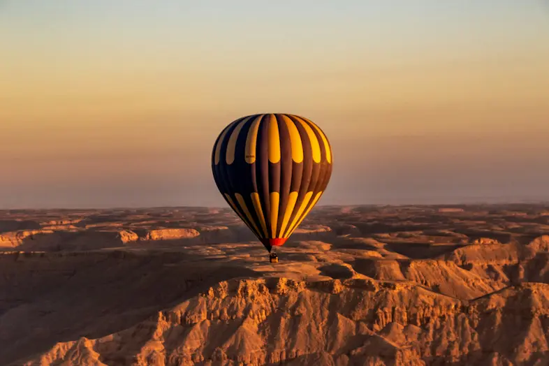 Private hot air balloon flight over Cappadocia Rose and Love Valleys in sunrise golden light - TurkDMC SHGM aviation protocol